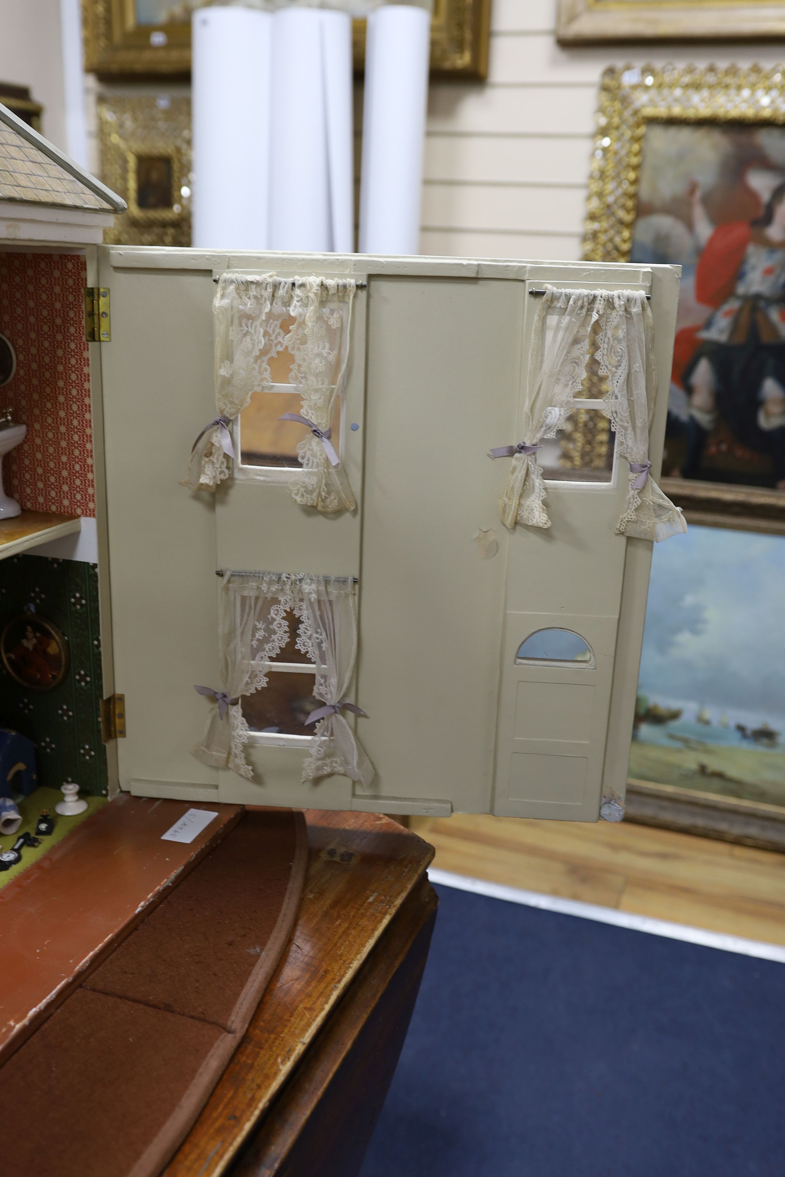 A dolls house, length 74cm, depth 39cm, height 66cm